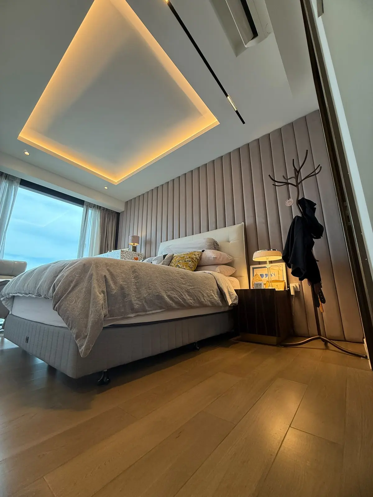 Parc Esta bedroom with fluted wall panel and cove lighting