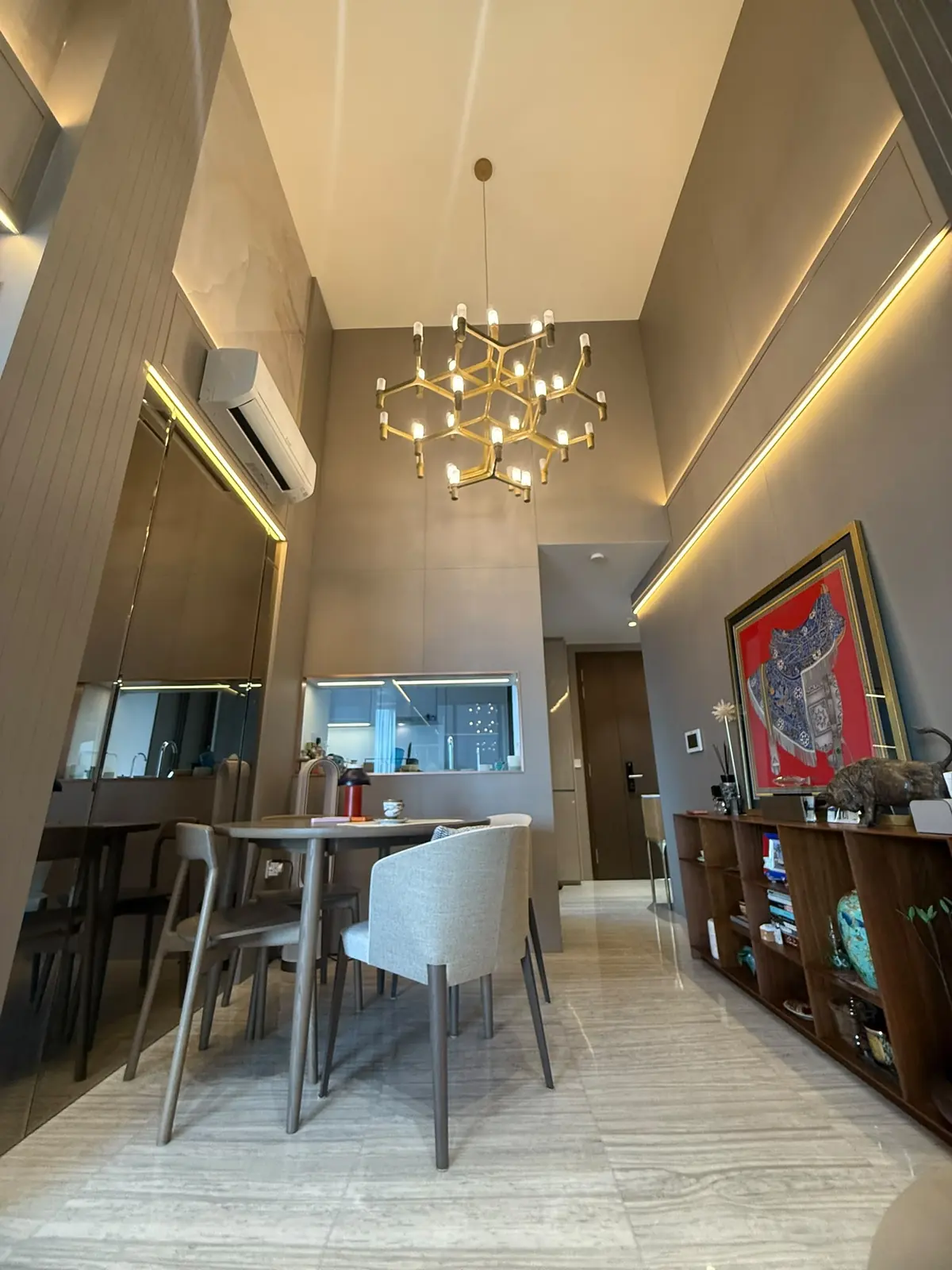 Parc Esta dining with wall console and kitchen pass-through
