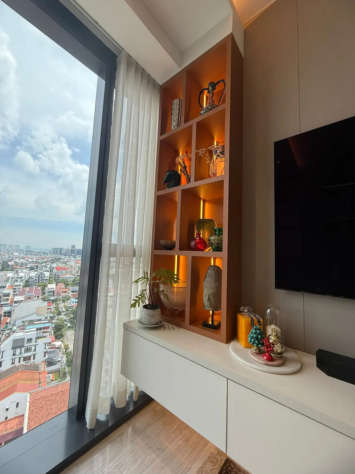 Parc Esta TV console and lit display niche by the window